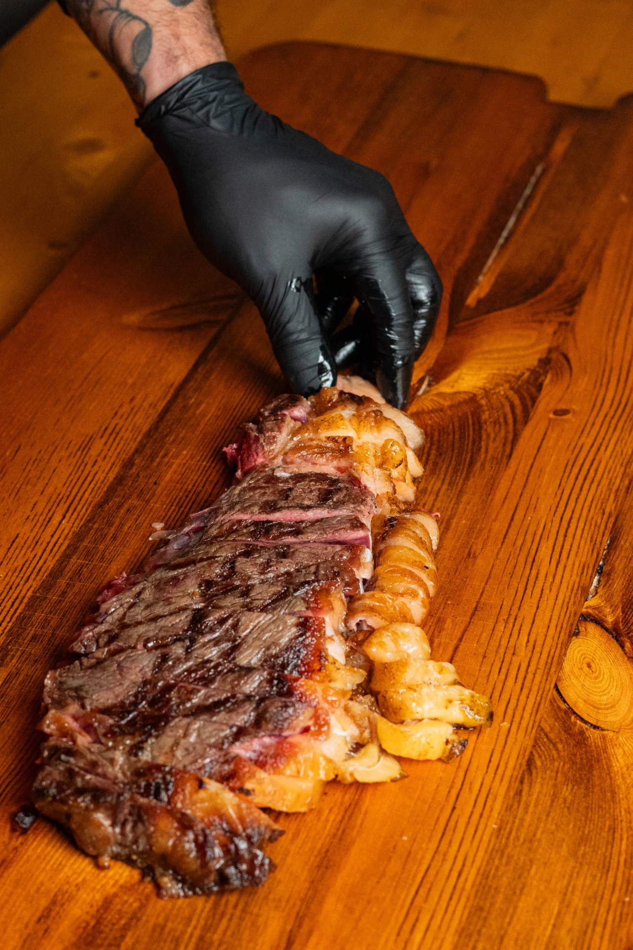 Rib steak served and carved by hand